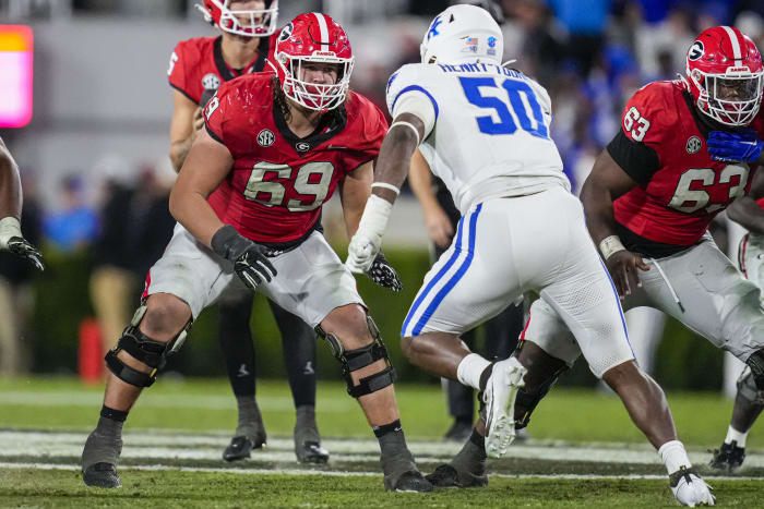 Oct 7, 2023; Athens, Georgia, USA; Georgia Bulldogs offensive lineman Tate Ratledge (69) blocks against Kentucky Wildcats defensive lineman Darrion Henry-Young (50) during the second half at Sanford Stadium.